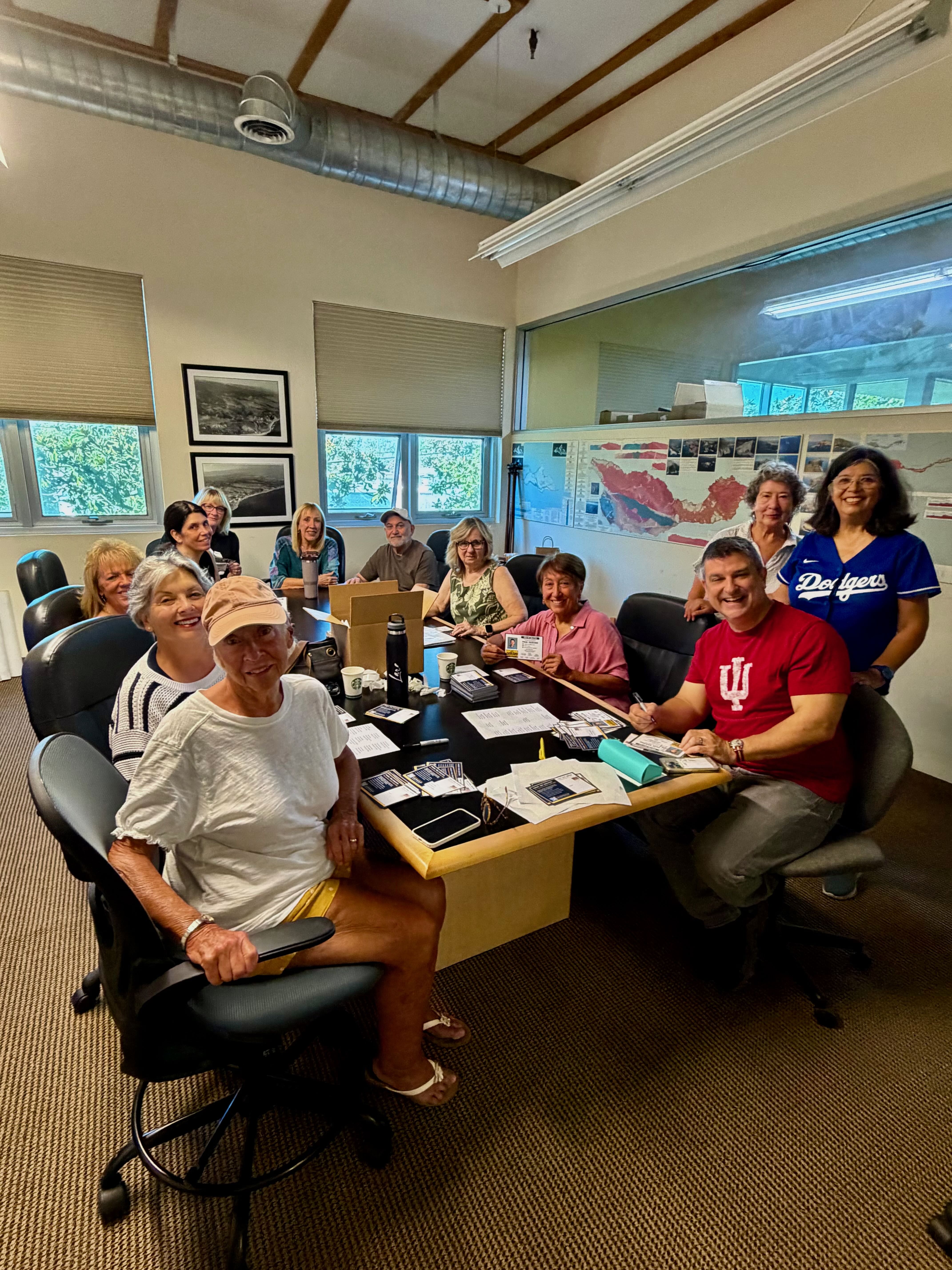 Volunteers preparing mailing invitations at campaign headquarters