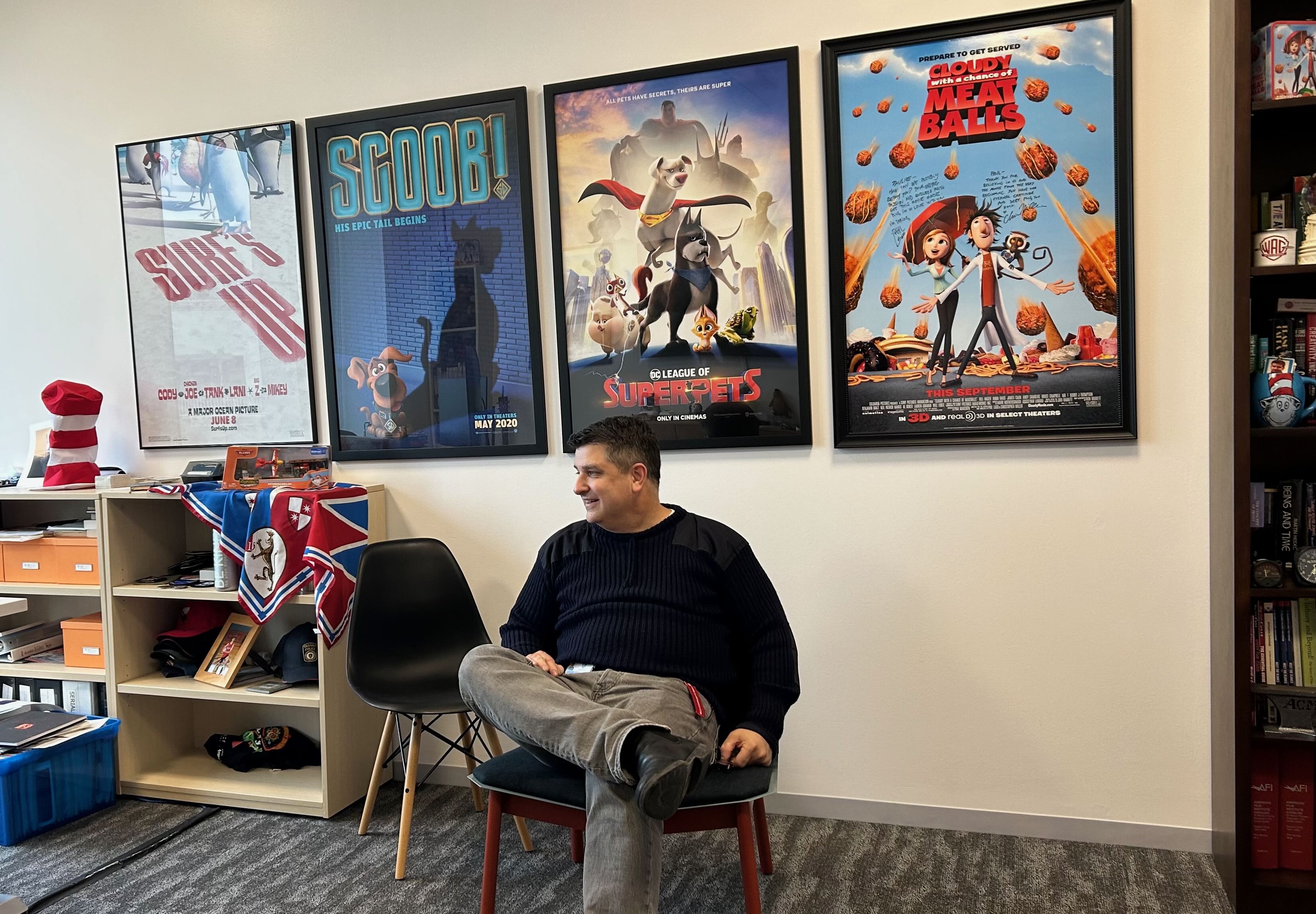 Paul in his office at Warner Animation Group with movie posters